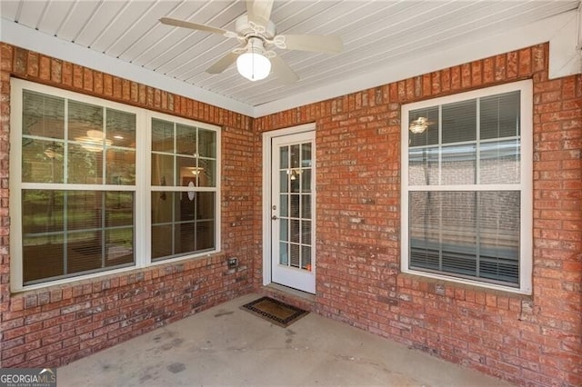 115 Pinnacle Ln, Mcdonough, GA 30253 - doorway to property featuring a ceiling fan and brick siding