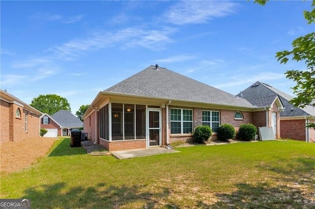 115 Pinnacle Ln, Mcdonough, GA 30253 - back of house with brick siding, a sunroom, a yard, and roof with shingles