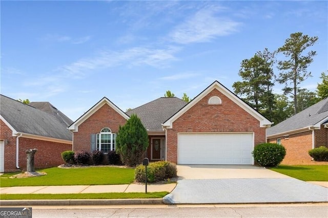 115 Pinnacle Ln, Mcdonough, GA 30253 - view of front of house featuring driveway, a front yard, brick siding, and a garage