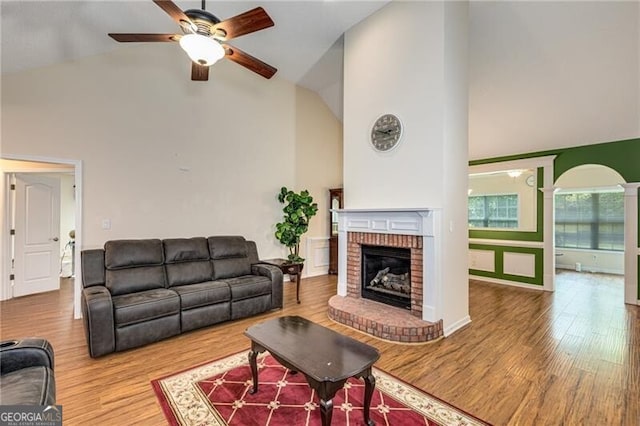 115 Pinnacle Ln, Mcdonough, GA 30253 - living area featuring high vaulted ceiling, ceiling fan, wood finished floors, and a fireplace