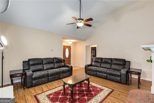 115 Pinnacle Ln, Mcdonough, GA 30253 - living room featuring a ceiling fan, wood finished floors, baseboards, and high vaulted ceiling
