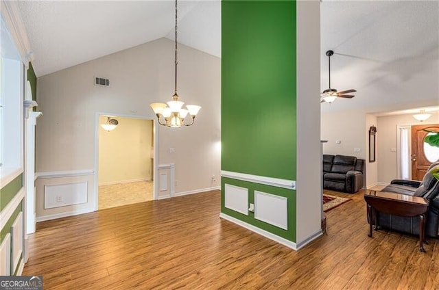 115 Pinnacle Ln, Mcdonough, GA 30253 - living room featuring high vaulted ceiling, a chandelier, a ceiling fan, and wood finished floors