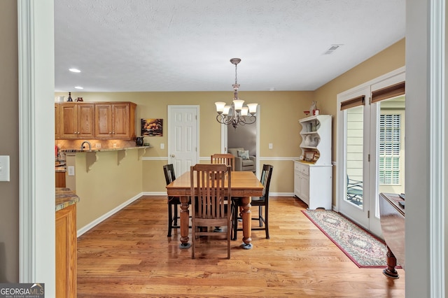 70 Merion Way, Newnan, GA 30265 - dining room with a chandelier, light wood-style floors, baseboards, and recessed lighting