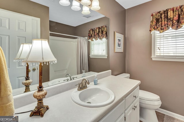 70 Merion Way, Newnan, GA 30265 - bathroom with toilet, vanity, a shower with curtain, a chandelier, and baseboards