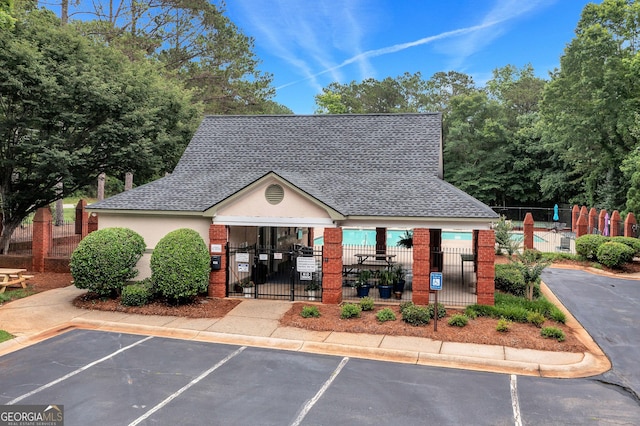 70 Merion Way, Newnan, GA 30265 - view of property with a fenced front yard and uncovered parking