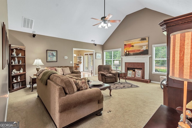 70 Merion Way, Newnan, GA 30265 - carpeted living area with a ceiling fan, high vaulted ceiling, a brick fireplace, and baseboards