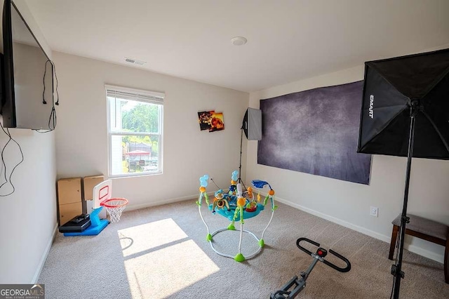 6827 Chataran Dr, Lithia Springs, GA 30122 - recreation room featuring carpet floors and baseboards