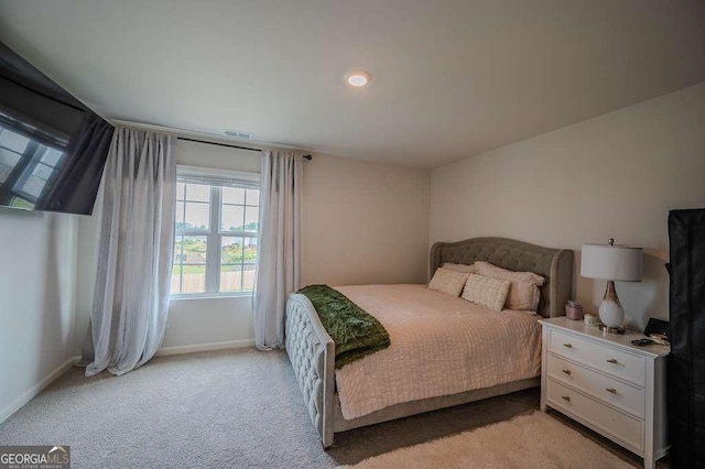 6827 Chataran Dr, Lithia Springs, GA 30122 - bedroom featuring light carpet and baseboards