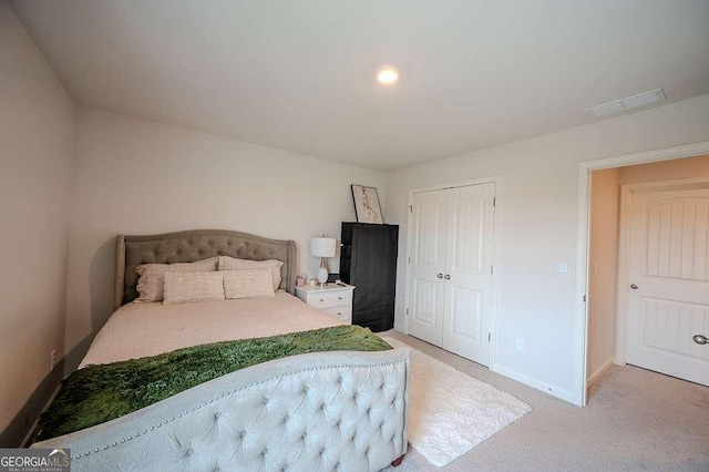 6827 Chataran Dr, Lithia Springs, GA 30122 - bedroom with light carpet, baseboards, and a closet