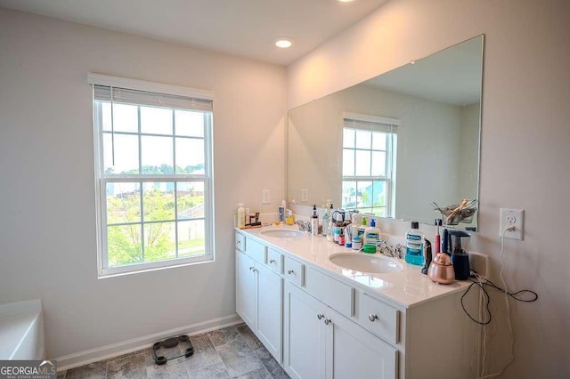 6827 Chataran Dr, Lithia Springs, GA 30122 - full bath featuring double vanity, baseboards, and recessed lighting