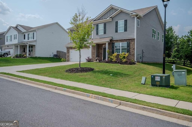 6827 Chataran Dr, Lithia Springs, GA 30122 - view of front of home with concrete driveway, brick siding, a front lawn, and cooling unit