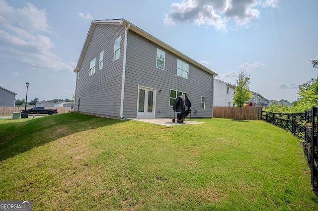 6827 Chataran Dr, Lithia Springs, GA 30122 - rear view of house featuring a patio