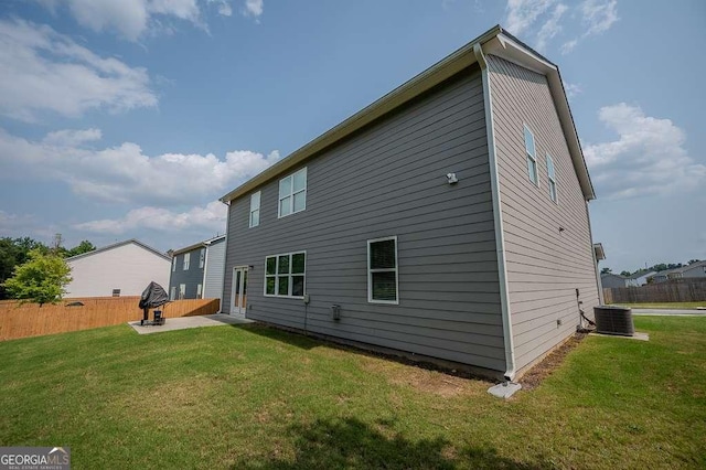 6827 Chataran Dr, Lithia Springs, GA 30122 - back of house featuring a patio area and central AC