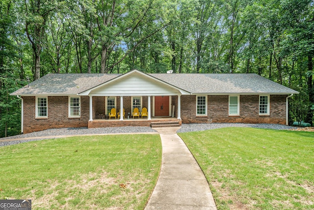1310 Chilton Woods Rd, Rutledge, GA 30663 - single story home featuring a porch, brick siding, roof with shingles, and a front yard