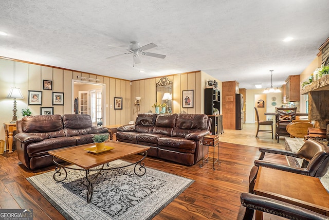 1310 Chilton Woods Rd, Rutledge, GA 30663 - living area with ceiling fan, dark wood-type flooring, ornamental molding, a textured ceiling, and a chandelier