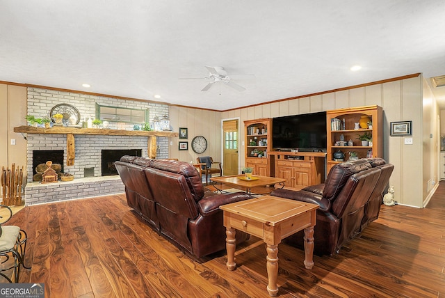 1310 Chilton Woods Rd, Rutledge, GA 30663 - living room with crown molding, wood finished floors, ceiling fan, a brick fireplace, and wood walls