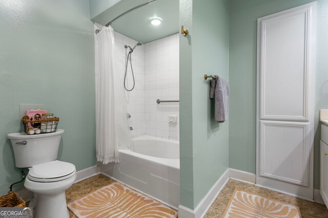 3777 Peachtree Rd NE Unit 1112, Brookhaven, GA 30319 - full bath featuring baseboards, toilet, shower / bath combo with shower curtain, and vanity