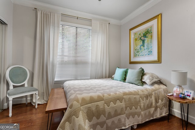 3777 Peachtree Rd NE Unit 1112, Brookhaven, GA 30319 - bedroom with baseboards, ornamental molding, and dark wood-style flooring