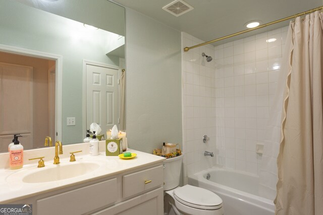3777 Peachtree Rd NE Unit 1112, Brookhaven, GA 30319 - full bathroom with vanity, shower / tub combo with curtain, and toilet