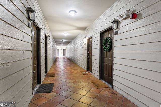 3777 Peachtree Rd NE Unit 1112, Brookhaven, GA 30319 - hall featuring tile patterned flooring and wooden walls
