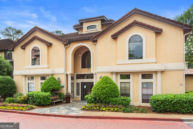 3777 Peachtree Rd NE Unit 1112, Brookhaven, GA 30319 - mediterranean / spanish-style home featuring stucco siding and a tile roof