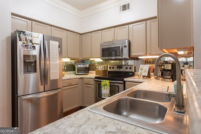 3777 Peachtree Rd NE Unit 1112, Brookhaven, GA 30319 - kitchen featuring appliances with stainless steel finishes, crown molding, and a sink
