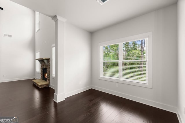 2855 Pilgrim Mill Rd, Cumming, GA 30041 - unfurnished living room featuring baseboards, dark wood-type flooring, and a fireplace