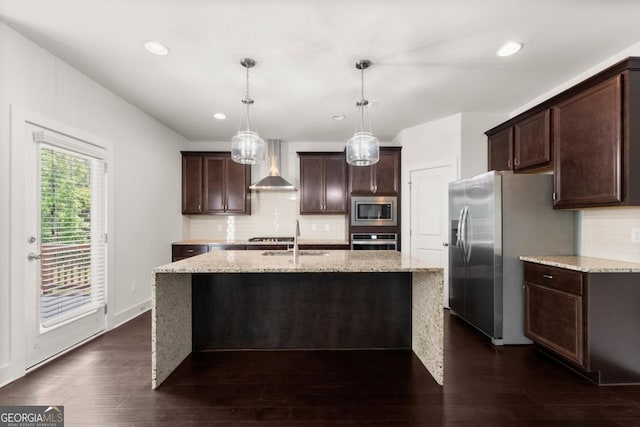 2855 Pilgrim Mill Rd, Cumming, GA 30041 - kitchen with stainless steel appliances, wall chimney range hood, a sink, dark brown cabinets, and recessed lighting
