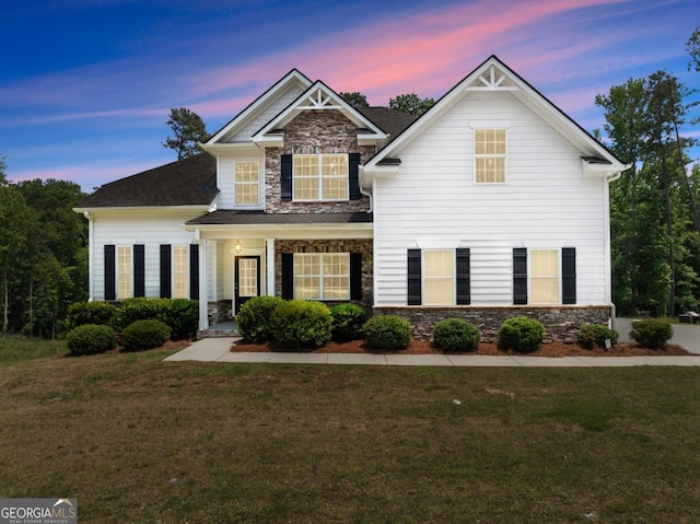2855 Pilgrim Mill Rd, Cumming, GA 30041 - craftsman-style house featuring stone siding, a front lawn, and roof with shingles