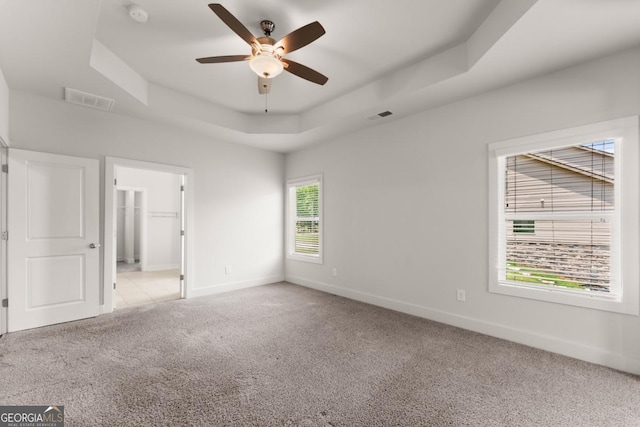 2855 Pilgrim Mill Rd, Cumming, GA 30041 - spare room featuring a raised ceiling, carpet floors, a ceiling fan, and a smoke detector