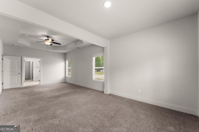 2855 Pilgrim Mill Rd, Cumming, GA 30041 - spare room with a raised ceiling, light colored carpet, and a ceiling fan