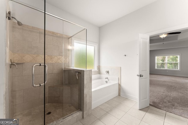 2855 Pilgrim Mill Rd, Cumming, GA 30041 - full bath with a bath, tile patterned floors, baseboards, a stall shower, and a ceiling fan