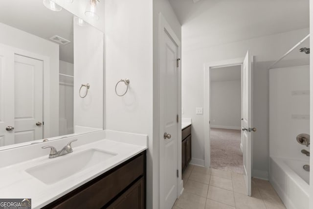 2855 Pilgrim Mill Rd, Cumming, GA 30041 - bathroom with vanity, washtub / shower combination, tile patterned floors, and baseboards