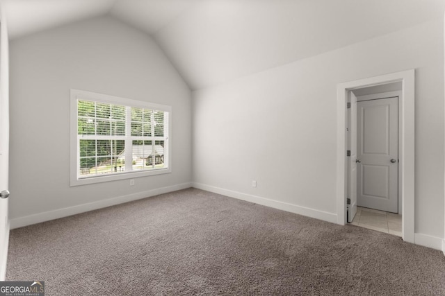 2855 Pilgrim Mill Rd, Cumming, GA 30041 - unfurnished bedroom featuring carpet floors, lofted ceiling, and baseboards