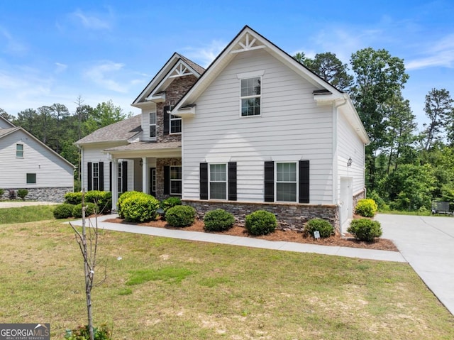 2855 Pilgrim Mill Rd, Cumming, GA 30041 - craftsman house with stone siding and a front lawn