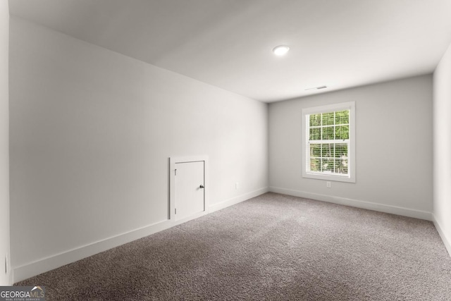 2855 Pilgrim Mill Rd, Cumming, GA 30041 - carpeted spare room with baseboards