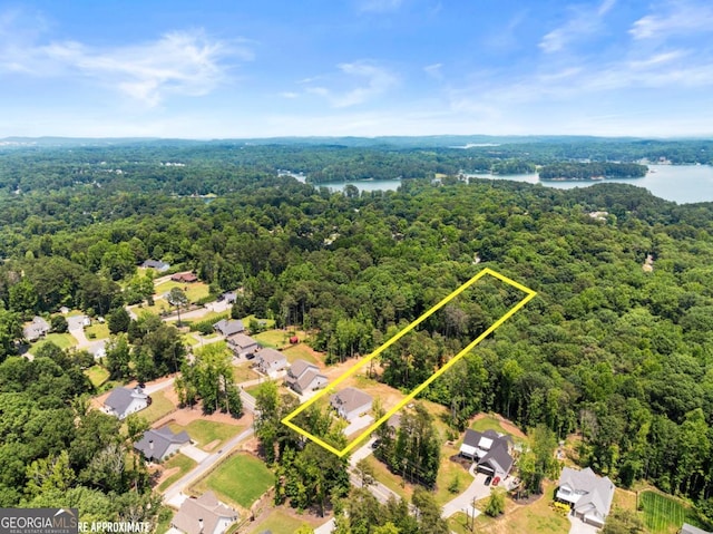 2855 Pilgrim Mill Rd, Cumming, GA 30041 - aerial view of residential area with a heavily wooded area, a nearby body of water, and property parcel outlined
