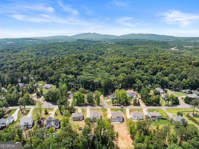 2855 Pilgrim Mill Rd, Cumming, GA 30041 - aerial view of residential area with a heavily wooded area and a mountain backdrop