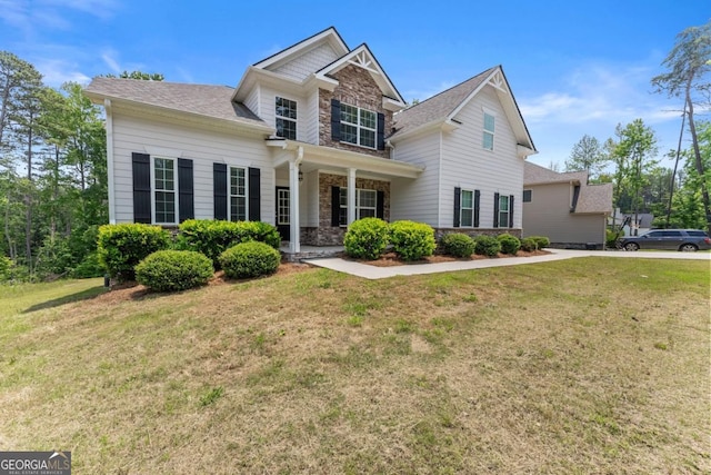 2855 Pilgrim Mill Rd, Cumming, GA 30041 - craftsman-style home with a front yard, stone siding, and roof with shingles