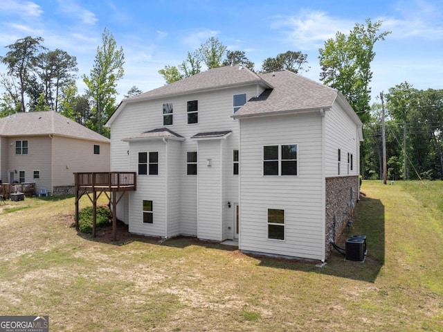 2855 Pilgrim Mill Rd, Cumming, GA 30041 - back of property featuring central AC, a lawn, a wooden deck, and roof with shingles