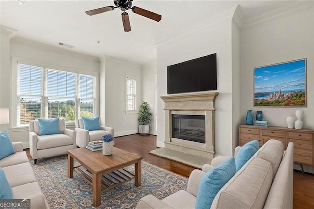 3635 Paces Cir Unit 1405, Atlanta, GA 30326 - living room with ornamental molding, ceiling fan, baseboards, a glass covered fireplace, and wood finished floors