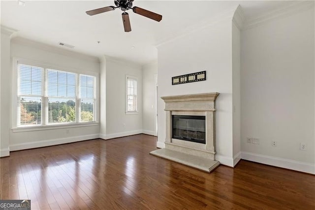 3635 Paces Cir Unit 1405, Atlanta, GA 30326 - unfurnished living room featuring crown molding, wood-type flooring, a ceiling fan, baseboards, and a glass covered fireplace