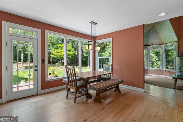 3498 Overland Trl, Ellenwood, GA 30294 - dining area featuring baseboards, healthy amount of natural light, light wood-style floors, recessed lighting, and a chandelier
