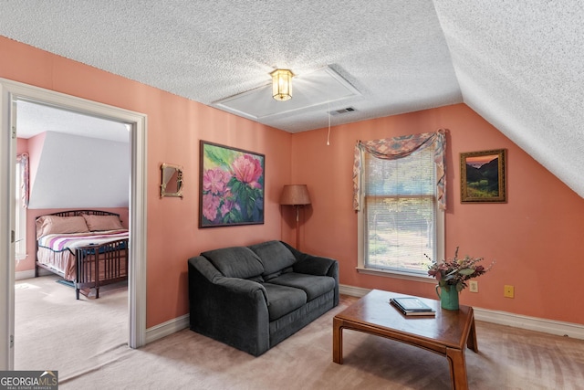 3498 Overland Trl, Ellenwood, GA 30294 - carpeted living room featuring attic access, a textured ceiling, baseboards, and vaulted ceiling