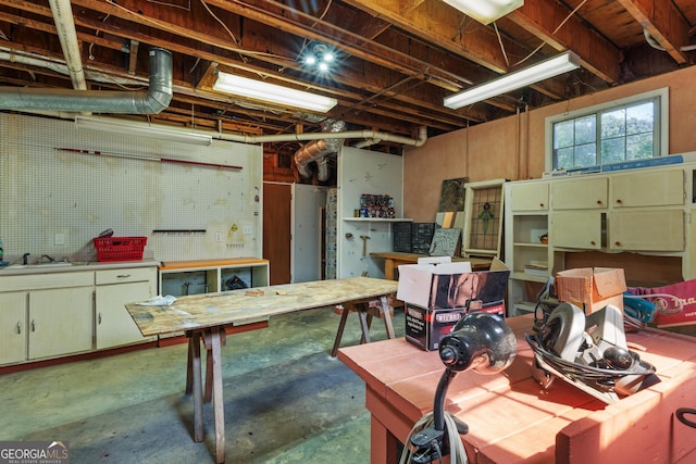 3498 Overland Trl, Ellenwood, GA 30294 - basement featuring a workshop area and a sink