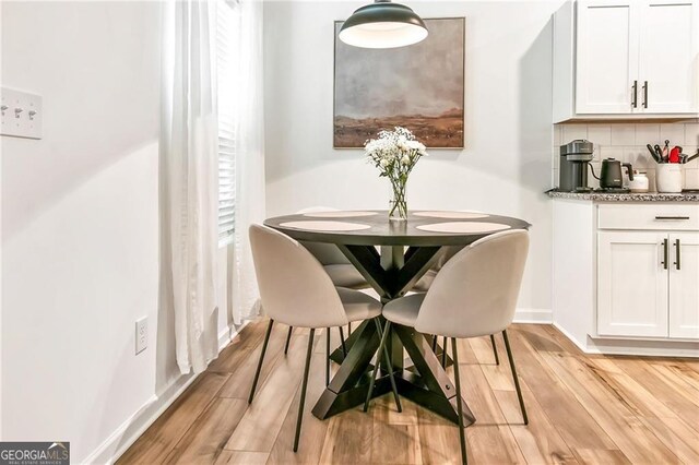 1363 Cooper Springs Rd, Grayson, GA 30017 - dining room with light wood-type flooring and baseboards