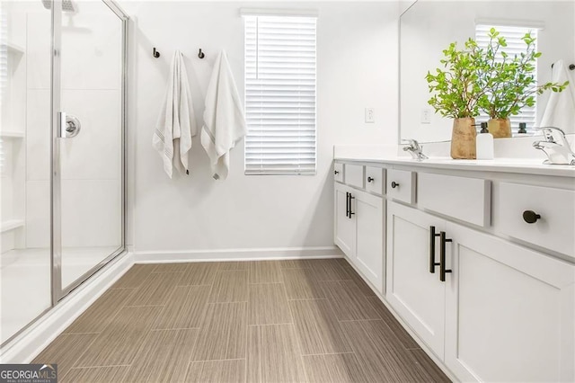 1363 Cooper Springs Rd, Grayson, GA 30017 - full bath featuring double vanity, a stall shower, and baseboards