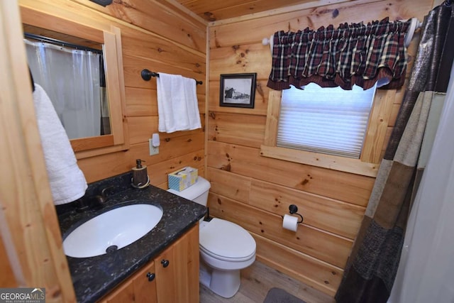 101 Porch View Cir Unit 121, Blairsville, GA 30512 - full bath featuring toilet, vanity, wooden walls, curtained shower, and wood finished floors