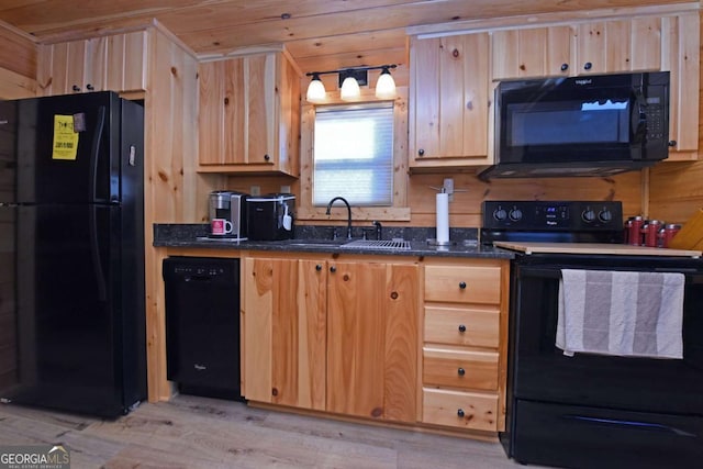101 Porch View Cir Unit 121, Blairsville, GA 30512 - kitchen with black appliances, light brown cabinetry, light wood-style flooring, a sink, and dark stone countertops