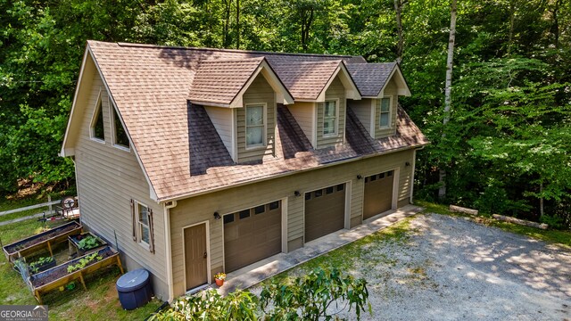534 Mountainside Dr, Rabun Gap, GA 30568 - view of front of home featuring roof with shingles and a detached garage